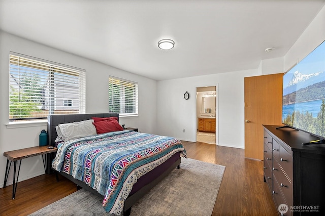1815 181st St E, Spanaway, WA 98387 - bedroom featuring dark wood-style flooring and connected bathroom
