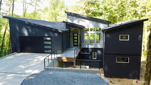 15 Sudden Valley Dr, Bellingham, WA 98229 - contemporary house featuring concrete driveway and a garage