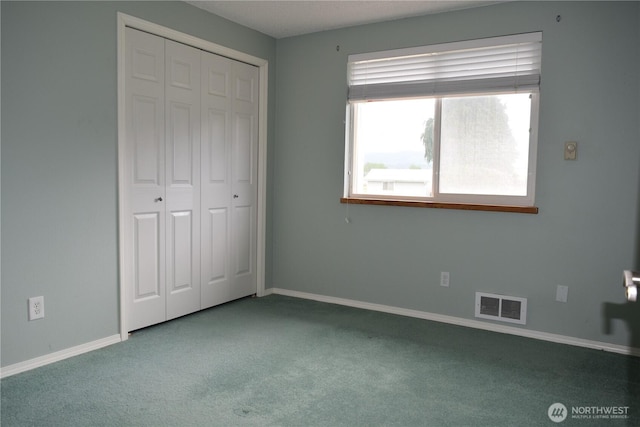 81 Ridge Pl, Sequim, WA 98382 - unfurnished bedroom featuring carpet and a closet