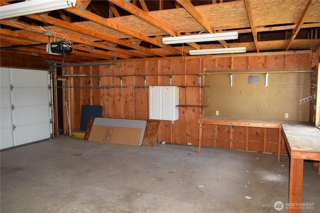 81 Ridge Pl, Sequim, WA 98382 - garage featuring a garage door opener and a workshop area