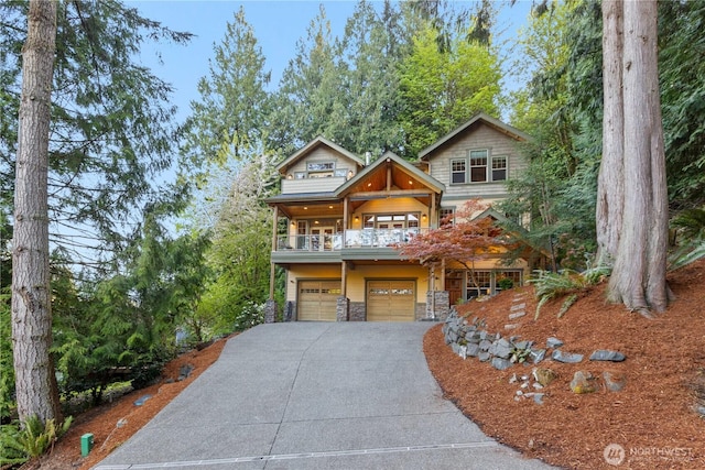 1 Valley View Cir, Bellingham, WA 98229 - view of front of house featuring an attached garage, a balcony, driveway, and stone siding