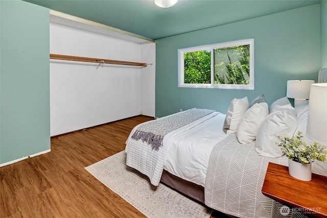 303 N 44th St Unit 105, Seattle, WA 98103 - bedroom with wood finished floors