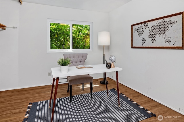 303 N 44th St Unit 105, Seattle, WA 98103 - home office with wood finished floors and baseboard heating
