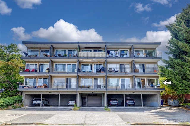 303 N 44th St Unit 105, Seattle, WA 98103 - view of apartment building / complex with covered parking
