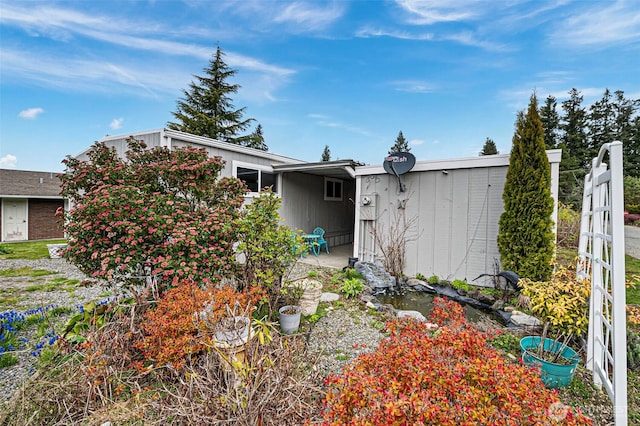 3702 Hunt St Unit 21, Gig Harbor, WA 98335 - view of side of home with a garden pond