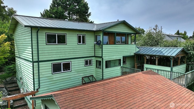3701N Whitman St, Tacoma, WA 98407 - back of house featuring a standing seam roof, a wooden deck, and a metal roof
