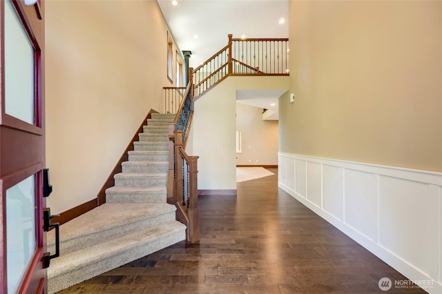 5728 SE 159th Ave, Snohomish, WA 98290 - stairs with wood finished floors, wainscoting, recessed lighting, and a high ceiling