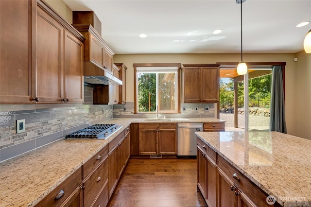 5728 SE 159th Ave, Snohomish, WA 98290 - kitchen featuring stainless steel appliances, healthy amount of natural light, dark wood-style floors, brown cabinetry, and recessed lighting