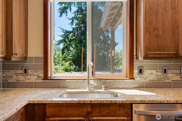 5728 SE 159th Ave, Snohomish, WA 98290 - kitchen with dishwasher, light stone counters, and tasteful backsplash