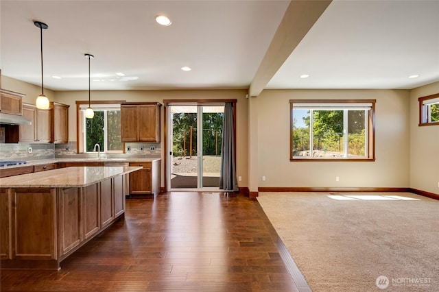 5728 SE 159th Ave, Snohomish, WA 98290 - kitchen featuring tasteful backsplash, recessed lighting, brown cabinets, decorative light fixtures, and cooktop