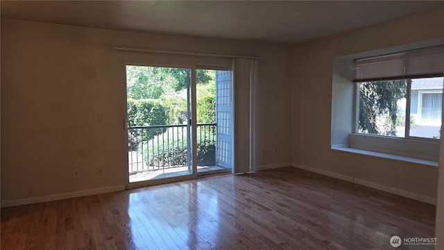1040 Columbia River Dr Unit 1, Vancouver, WA 98664 - empty room featuring healthy amount of natural light and wood finished floors