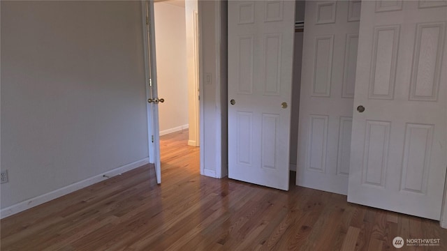 1040 Columbia River Dr Unit 1, Vancouver, WA 98664 - unfurnished bedroom with wood finished floors and a closet