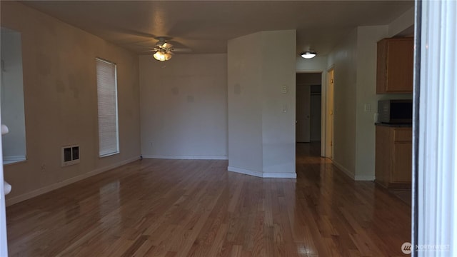 1040 Columbia River Dr Unit 1, Vancouver, WA 98664 - unfurnished living room with a ceiling fan and wood finished floors