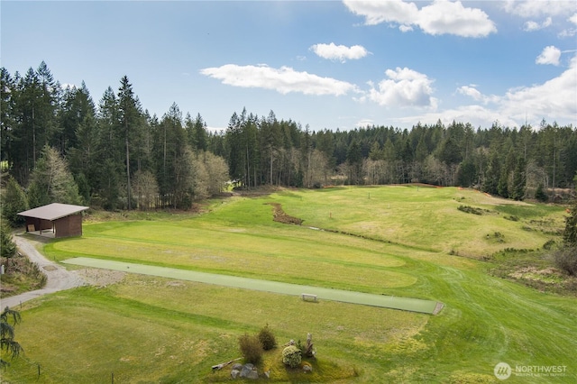 6834 Kenfig Pl SW, Port Orchard, WA 98367 - view of property's community featuring a wooded view, a lawn, golf course view, and an outbuilding