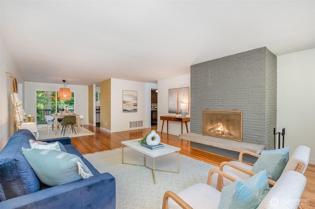 2329 NE 103rd St, Seattle, WA 98125 - living area with wood finished floors and a fireplace