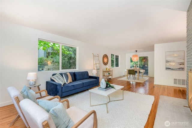 2329 NE 103rd St, Seattle, WA 98125 - living area featuring light wood-style flooring and baseboards