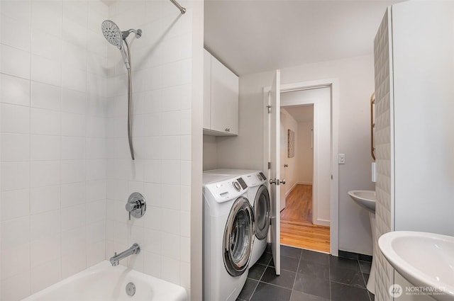 2329 NE 103rd St, Seattle, WA 98125 - bathroom featuring washing machine and dryer, bathtub / shower combination, and tile patterned floors