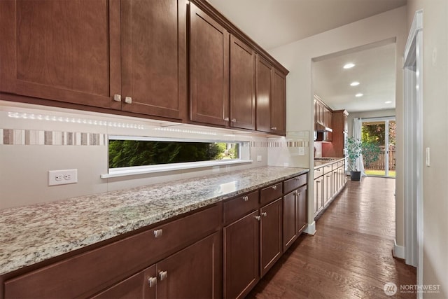 8910 Buttercup St SE, Tumwater, WA 98501 - kitchen with dark wood finished floors, light stone counters, recessed lighting, and backsplash