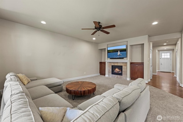 8910 Buttercup St SE, Tumwater, WA 98501 - living area featuring recessed lighting, carpet flooring, a ceiling fan, and a tiled fireplace