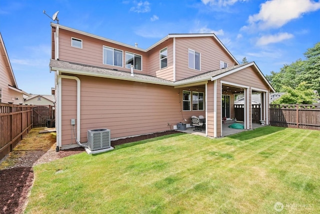 8910 Buttercup St SE, Tumwater, WA 98501 - rear view of house featuring a patio area, a fenced backyard, and a shingled roof