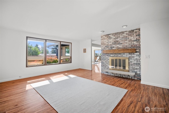 6084 Summit View Pl, Ferndale, WA 98248 - unfurnished living room featuring a fireplace and wood finished floors