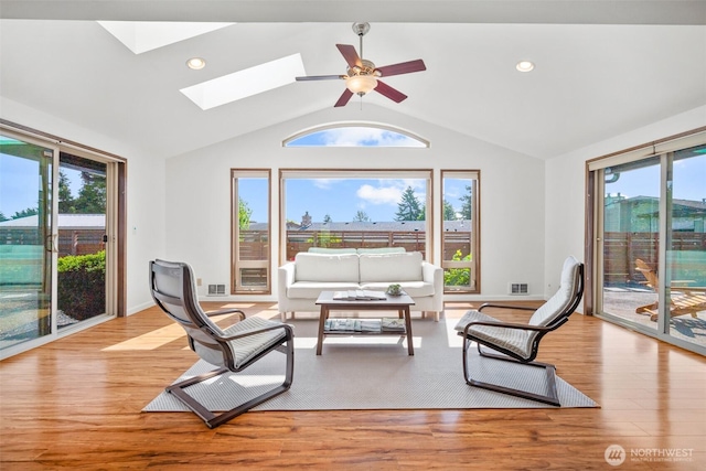 6084 Summit View Pl, Ferndale, WA 98248 - living area with vaulted ceiling, wood finished floors, a skylight, recessed lighting, and ceiling fan