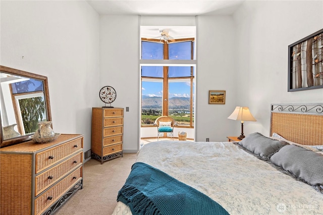 71 Blue Grade Rd, East Wenatchee, WA 98802 - bedroom featuring light colored carpet, a high ceiling, and a mountain view