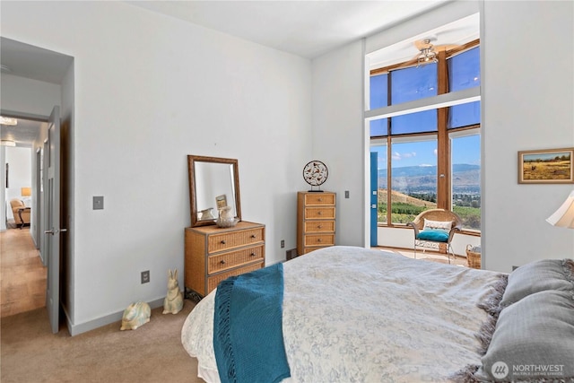 71 Blue Grade Rd, East Wenatchee, WA 98802 - bedroom featuring access to outside, light carpet, and a towering ceiling