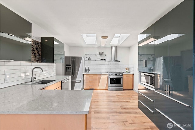 71 Blue Grade Rd, East Wenatchee, WA 98802 - kitchen with open shelves, high quality appliances, wall chimney exhaust hood, a skylight, and tasteful backsplash