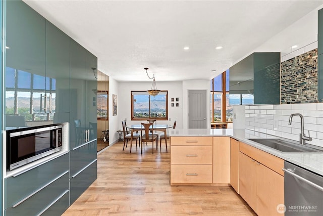 71 Blue Grade Rd, East Wenatchee, WA 98802 - kitchen with appliances with stainless steel finishes, light brown cabinets, plenty of natural light, light countertops, and recessed lighting