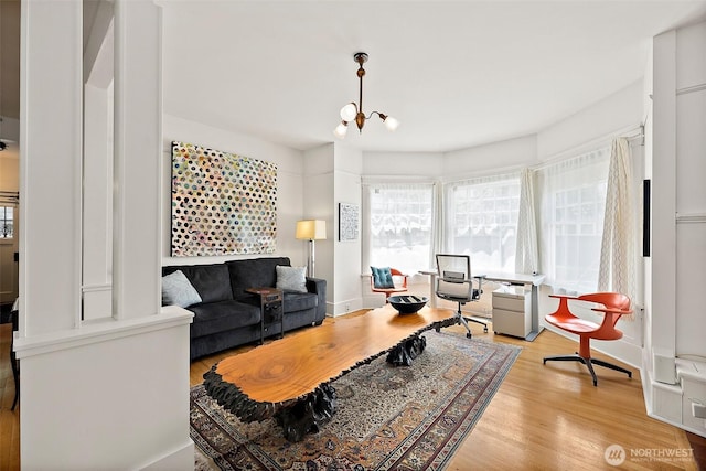 1222 N 4th St, Tacoma, WA 98403 - living room featuring light wood-style floors and a chandelier