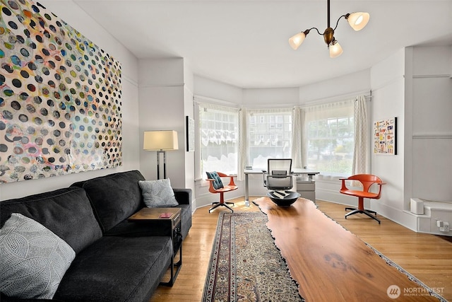 1222 N 4th St, Tacoma, WA 98403 - living area with light wood-style floors and a chandelier