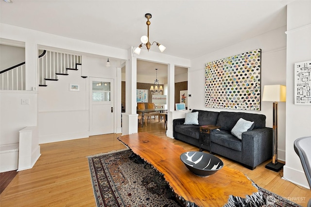 1222 N 4th St, Tacoma, WA 98403 - living area with a chandelier, light wood finished floors, and stairs