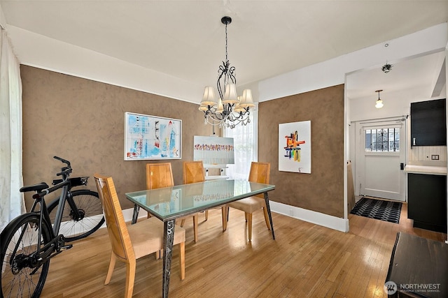 1222 N 4th St, Tacoma, WA 98403 - dining space with light wood finished floors and a chandelier