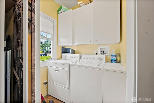 1222 N 4th St, Tacoma, WA 98403 - laundry room with cabinet space, independent washer and dryer, and wood finished floors