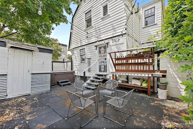 1222 N 4th St, Tacoma, WA 98403 - view of patio / terrace featuring a hot tub and a deck