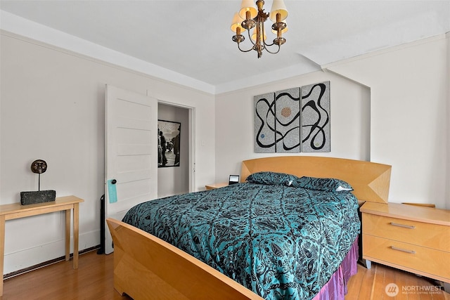 1222 N 4th St, Tacoma, WA 98403 - bedroom with wood finished floors and a chandelier