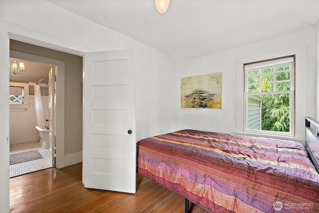 1222 N 4th St, Tacoma, WA 98403 - bedroom with wood finished floors, a chandelier, lofted ceiling, and ensuite bathroom