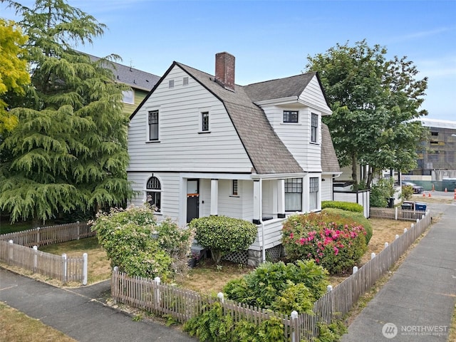 1222 N 4th St, Tacoma, WA 98403 - view of front of house featuring roof with shingles and a chimney