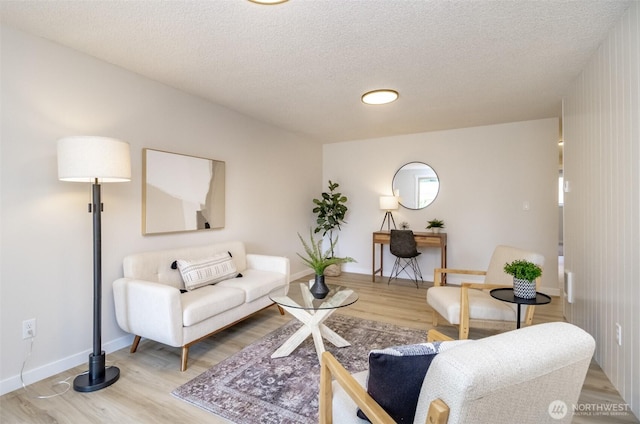 1626 E 59th St, Tacoma, WA 98404 - living room with light wood-style flooring and a textured ceiling