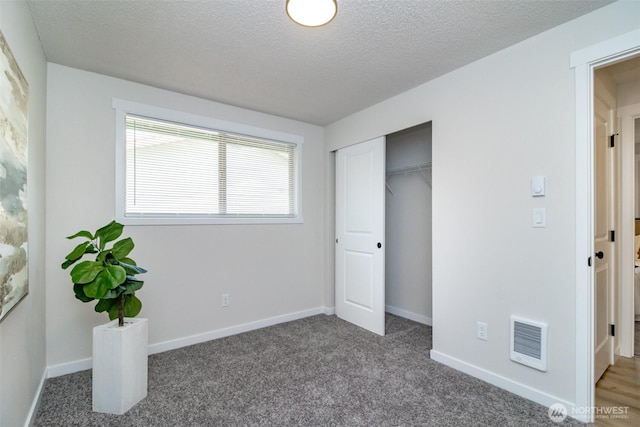 1626 E 59th St, Tacoma, WA 98404 - unfurnished bedroom with carpet, a closet, and a textured ceiling