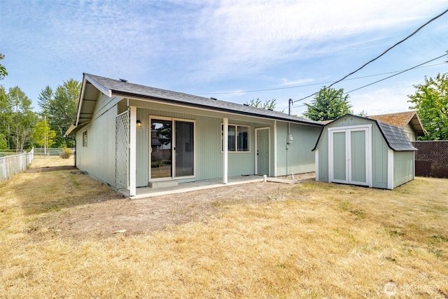 1626 E 59th St, Tacoma, WA 98404 - rear view of property with a storage unit and a patio area