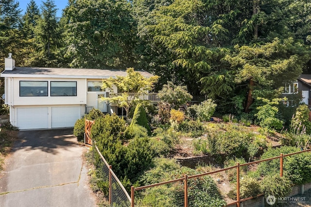 27727 94th Ave SW, Vashon, WA 98070 - view of front facade featuring driveway, a garage, and a chimney