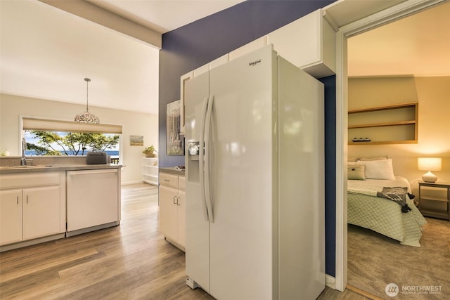 27727 94th Ave SW, Vashon, WA 98070 - kitchen featuring white appliances, white cabinetry, light wood finished floors, and pendant lighting
