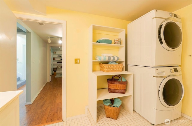 27727 94th Ave SW, Vashon, WA 98070 - washroom with estacked washer and dryer and light wood finished floors