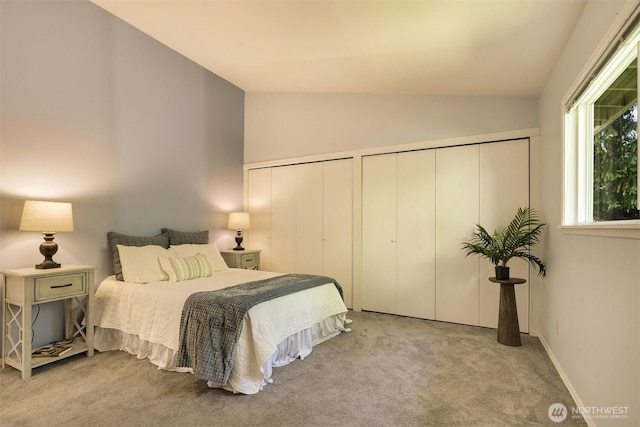 27727 94th Ave SW, Vashon, WA 98070 - carpeted bedroom featuring lofted ceiling and multiple closets