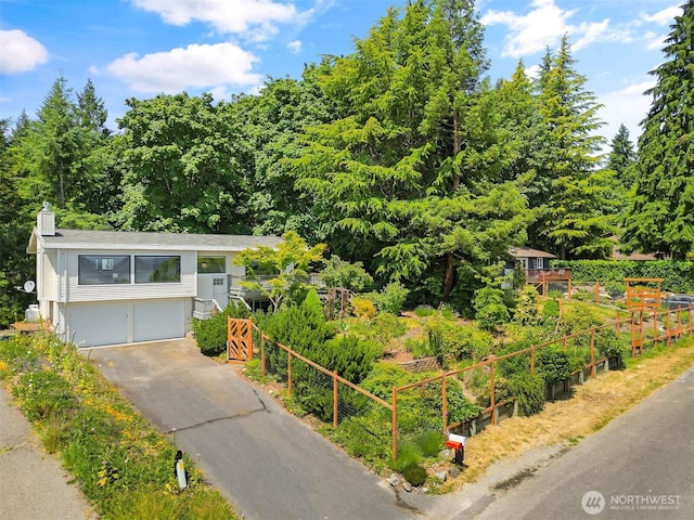 27727 94th Ave SW, Vashon, WA 98070 - view of front of house featuring asphalt driveway and an attached garage
