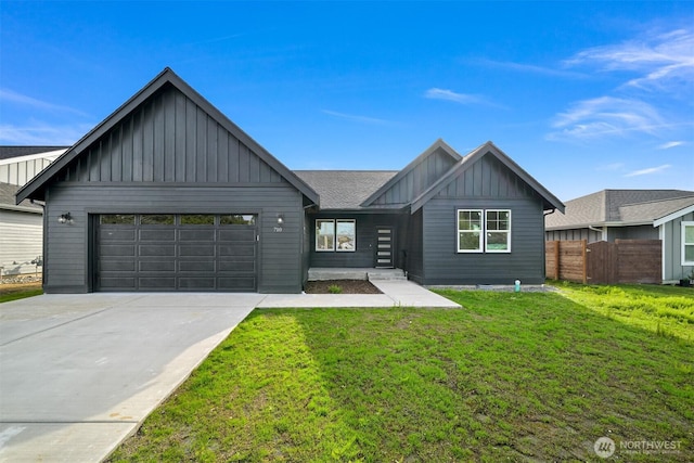 710 E 4th St, Nooksack, WA 98276 - view of front of property with board and batten siding, an attached garage, and driveway