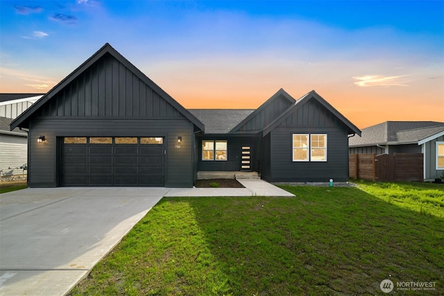 710 E 4th St, Nooksack, WA 98276 - view of front of home featuring board and batten siding, a garage, and concrete driveway