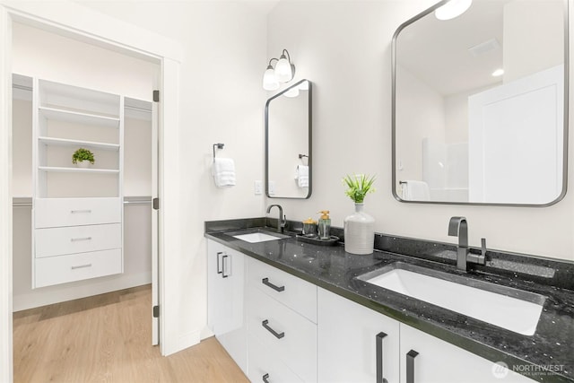 710 E 4th St, Nooksack, WA 98276 - bathroom featuring wood finished floors and double vanity